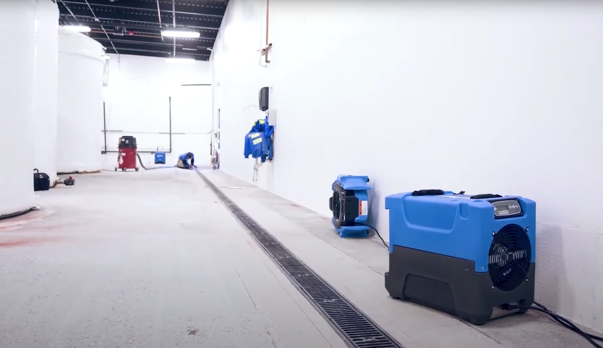 Large-scale water damage restoration in commercial space with industrial equipment